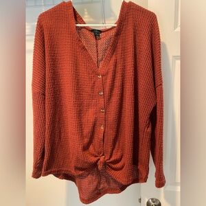 Rust colored waffle knit long sleeve tie front top. Size 1X.